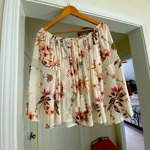 Small woman’s flower top off the shoulders